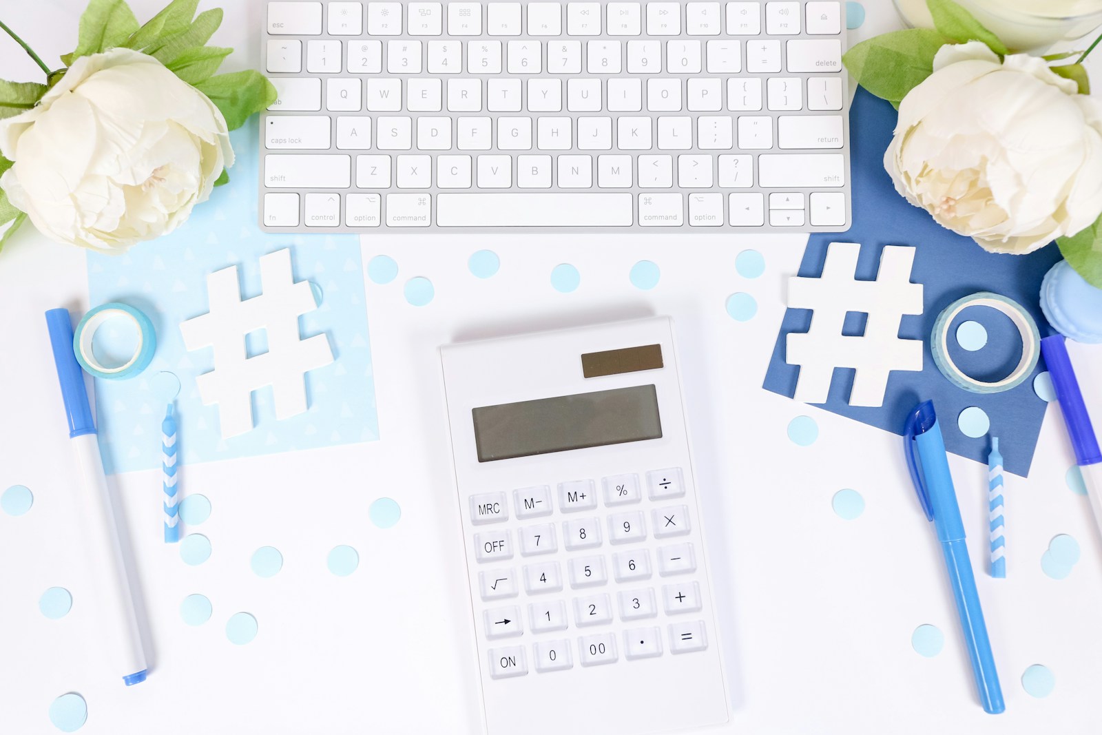 199A .white and black calculator on white and blue textile